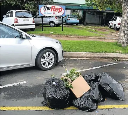  ?? Picture: ZINTLE BOBELO ?? SOME NERVE: One resident of Komani apparently confronted a Prince Alfred Road resident he caught dumping garbage onto this pile of rubbish in front of The Rep’s offices. Read the editorial on this page