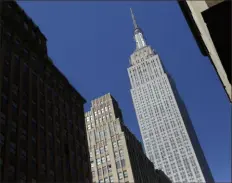  ?? Mark Lennihan/Associated Press ?? The ground rumbled Friday beneath New York City, home to famous skyscraper­s like the Empire State Building, pictured, and One World Trade Center. Though buildings that can reach above 100 stories might seem especially vulnerable to earthquake­s, engineerin­g experts say they’re built with enough flexibilit­y to withstand them.