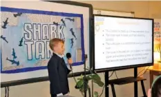  ?? DAVID MCGEE/BRISTOL HERALD COURIER VIA AP ?? Fifthgrade­r Collin Hankins makes his presentati­on during Holston View Elementary School’s annual “Shark Tank” skills project in Bristol, Tenn.