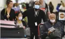  ?? Photograph: Curtis Compton/AP ?? Passengers returning on a Delta flight from Amsterdam at Hartsfield Jackson internatio­nal airport in Atlanta.