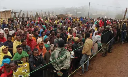  ?? Photograph: Nashon Tado/NRC ?? Some of the roughly 500,000 Ethiopians displaced by the Tigray civil war wait for aid. The NRC said the government had warned it over its advocacy on aid needs.