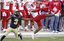  ?? ASSOCIATED PRESS ?? Cornerback Cam Taylor-Britt (right), the Bengals’ second-round draft pick, signed his contract Friday. So did seventh-rounder Jeff Gunter, leaving only offensive lineman Cordell Volson and defensive lineman Zach Carter to get deals done.