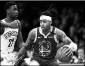  ?? Associated Press ?? MOVING
Golden State Warriors guard D’Angelo Russell (0) drives next to Brooklyn Nets guard Caris LeVert (22) during the first half of an NBA basketball game Wednesday in New York.