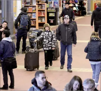  ?? Courier file photo ?? The 20-year agreement struck to begin charging passengers an airport improvemen­t fee at YLW in 1998 did not include renewal clause. Council will consider an extension today so a new agreement between airports and airlines can be worked out.