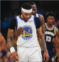  ?? Tribune News Service/getty Images ?? The Golden State Warriors’ Draymond Green (23) checks on teammate Gary Payton II (0) as he was taking free throws after being fouled against the Memphis Grizzlies in the first quarter of Game 2 of an NBA Western Conference playoff series in Memphis on Tuesday.