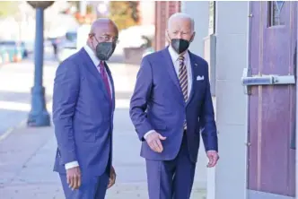  ?? AP PHOTO/PATRICK SEMANSKY ?? President Joe Biden and Sen. Raphael Warnock, D-Ga., enter Ebenezer Baptist Church on Wednesday in Atlanta.