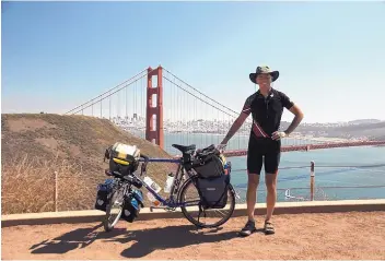  ??  ?? Russ McCoy and his fully loaded touring bicycle near the Golden Gate Bridge in San Francisco, Calif., during a tour in 2015.