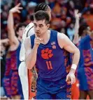 ?? Adrian Kraus/Associated Press ?? Clemson’s Joe Girard III, from Glens Falls, scored 18 points against his old team to reach the milestone.