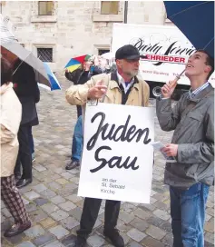  ?? (Courtesy of Kastner) ?? ACTIVIST WOLFRAM KASTNER informs a passerby about a Judensau, or ‘Jews’ sow’.