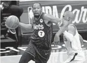  ?? KATHY WILLENS AP ?? Nets’ Kevin Durant, who had 33 points off the bench, drives to the basket against Suns’ Chris Paul.