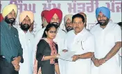  ??  ?? ■ School education minister OP Soni (2nd from right) and revenue minister Sukhbinder Singh Sarkaria (centre) and MP GS Aujla (right) handing over an offer letter to a teacher on Friday. HT PHOTO