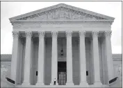  ?? ASSOCIATED PRESS ?? A POLICE OFFICER GUARDS THE MAIN ENTRANCE Supreme Court in Washington, Tuesday. to the