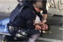  ??  ?? Right: Australian police stand near a crashed vehicle after they arrested the driver who had ploughed into pedestrian­s at a crowded intersecti­on near the Flinders Street train station in central Melbourne, Australia, yesterday. Photo: Luis...