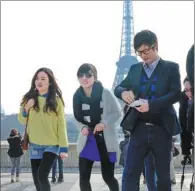  ?? ERIC FEFERBERG / AFP ?? Chinese tourists visit the Eiffel Tower in Paris.