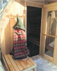  ??  ?? A Canadian-inspired tartan robe sits outside a barrel sauna, one of several steam facilities that are planned for the Kananaskis Nordic Spa.