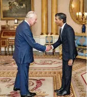  ?? AFP ?? Britain’s King Charles III greets newly appointed Conservati­ve Party leader and incoming Prime Minister Rishi Sunak on Tuesday.