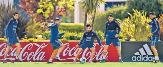  ??  ?? Argentina's (LR) Angel Di Maria, Gabriel Mercado, Lautaro Acosta, Nicolas Otamendi and Ever Banega during a training session. (Below) Lionel Messi.