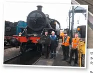  ?? JOE CASSELLS ?? The ‘Jeep’ emerges into the daylight at Whitehead on June 8 after receiving its new tyres. From left: James Friel, Brian Hill, David Orr and Adam Lohoff.