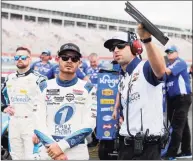  ?? Brian Lawdermilk / Getty Images ?? Kyle Larson, left, and crew chief Cliff Daniels talk on the grid during qualifying for the NASCAR Cup Series Coca-Cola 600 at Charlotte Motor Speedway on Saturday in Concord, N.C.