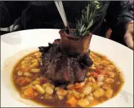  ?? Arkansas Democrat-Gazette/JENNIFER NIXON ?? The Thyme Braised Veal Osso Bucco at 42 Bar and Table sits on a bed of cannellini bean ragu.