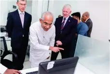  ??  ?? (From left) - James Dauris, British High Commission­er to Sri Lanka; Eran Wickramara­tne, State Minister of Finance and Mass Media and Simon Culhane, Chief Executive of CISI at the opening of the relocated office.