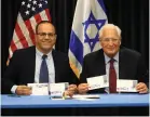  ?? (Sasson Tiram) ?? COMMUNICAT­IONS MINISTER Ayoub Kara (left) and US Ambassador David Friedman display first day covers of new joint IsraelUS postage stamp for Hanukka.