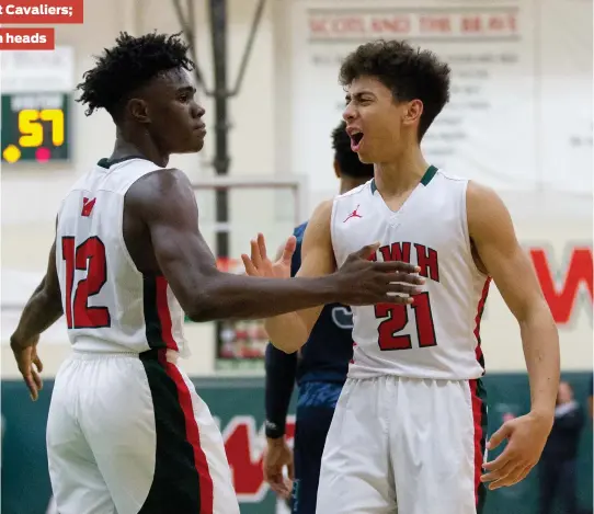  ?? Jason Fochtman / Houston Chronicle ?? The Woodlands’ Thomas Williams (21) and KeSean Carter (12) got the best of rival College Park once again.