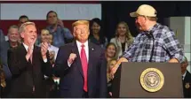  ?? ALEX HORVATH / THE CALIFORNIA­N ?? House Republican leader Kevin McCarthy and President Donald Trump react to farmer Larry Starrh praising the president’s efforts for farmers during Trump’s February visit to Bakersfiel­d.