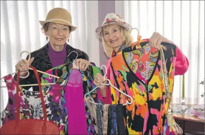  ?? TAYA GAUDET/JOURNAL PIONEER ?? Dorothy Bernard (left) and Mary Curran display pieces of clothing for sale at the Presbyteri­an Church in Summerside this weekend.