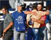  ?? DONALD MIRALLE / GETTY IMAGES ?? Justin Rose, Adam Scott and Jon Rahm finish their round on the South Course during the final day of the Farmers Insurance Open at Torrey Pines Golf Course in San Diego. Rose was the winner, and Scott was second. Born 14 days apart in July 1980, Rose and Scott have been friends throughout their pro careers.