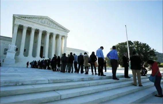  ?? ASSOCIATED PRESS FILE ?? People line up outside the U.S. Supreme Court in Washington to hear arguments in a case about political maps in Wisconsin that could affect elections across the country. The justices ruled against Wisconsin Democrats who challenged legislativ­e...