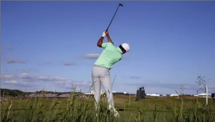  ?? RICK WOOD, TNS ?? Brooks Koepka drives off the 18th tee on his way to a 16-under par to win the the U.S. Open Championsh­ip on Sunday.