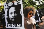  ?? JOHN MINCHILLO / ASSOCIATED PRESS ?? Protesters gather in June for a demonstrat­ion at the University of Cincinnati demanding that a white former police officer be tried a third time in the fatal shooting of an unarmed black motorist.