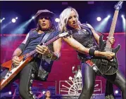  ?? ?? Ryan Roxie, left, and Nita Strauss of the Alice Cooper band performs in Chicago in July 2019. Both musicians will be accompanyi­ng Alice Cooper at Shaky Knees.