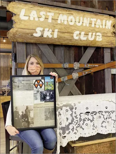  ?? Photo contribute­d ?? Jaden Cormack, museum and visitor services co-ordinator at the Westbank Museum, shows off a shadowbox for the Last family, part of an ongoing project at the museum. A photo of the shadowbox as well as informatio­n on the Last family will be posted on the Westbank Museum’s social media and website as part of Shadowbox Saturday, one of the daily posts the museum will be making as part of Heritage Week Feb. 15 to 22.