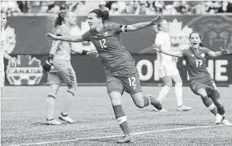  ?? PETER POWER THE CANADIAN PRESS ?? Canada’s Christine Sinclair celebrates after scoring against Germany during the second half of women’s soccer-friendly action at Tim Hortons Field in Hamilton on Sunday. Germany won the game, 3-2.