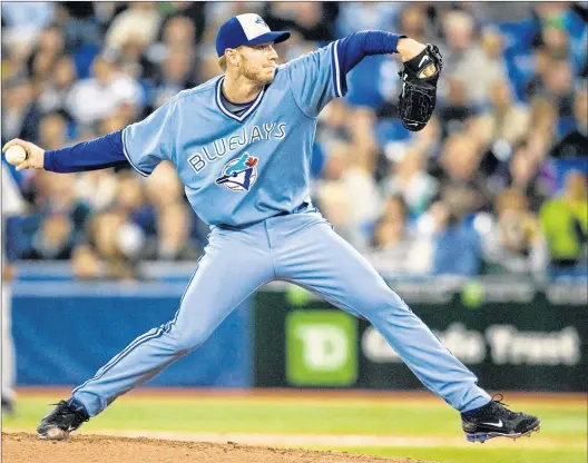  ?? CP PHOTO ?? Roy Halladay throws as a member of the Toronto Blue Jays during a game in Toronto in September 2009.