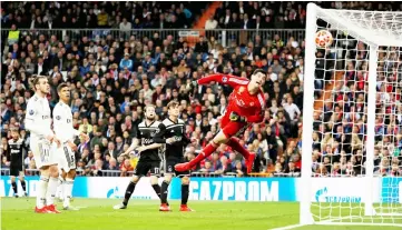  ?? — Reuters photo ?? Ajax’s Lasse Schone (third left) scores their fourth goal during the UEFA Champions League round of 16 second leg match against Real Madrid at the Santiago Bernabeu stadium in Madrid.