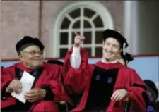  ?? STEVEN SENNE ‑ THE ASSOCIATED PRESS ?? Facebook CEO and Harvard dropout Mark Zuckerberg, right, gestures as actor James Earl Jones, left, looks on while seated on stage during Harvard University commenceme­nt exercises, Thursday, in Cambridge, Mass. Zuckerberg was presented with an honorary...