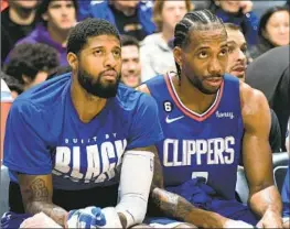  ?? Adam Pantozzi NBAE ?? PAUL GEORGE, left, and Kawhi Leonard won just three playoff series together. “We all have something to prove,” Clippers executive Lawrence Frank says.