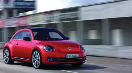  ?? VOLKSWAGEN ?? The 2012 Beetle can be distinguis­hed by its lower roofline and flattened-out panels. It was a three-door hatchback with seating for four people, not five.