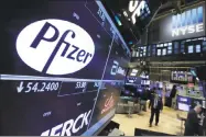  ?? Associated Press ?? The Pfizer logo appears on a screen above its trading post on the floor of the New York Stock Exchange. Pfizer said Tuesday it may sell its consumer health care business as part of a strategic review.