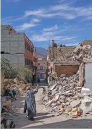  ?? AP PHOTO/MOSA’AB ELSHAMY ?? On Oct. 6, a man points to damage caused by the earthquake in Amizmiz, outside Marrakech.