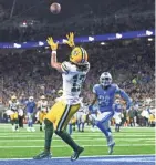  ?? TIM FULLER/USA TODAY SPORTS ?? Packers wide receiver Davante Adams catches a touchdown pass during the third quarter against the Lions. Adams finished the regular season with 997 receiving yards.