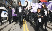  ?? Paul Chinn / The Chronicle 2016 ?? Yayne Abeba leads a January 2016 protest on Powell Street after the police killing of Mario Woods in the Bayview.