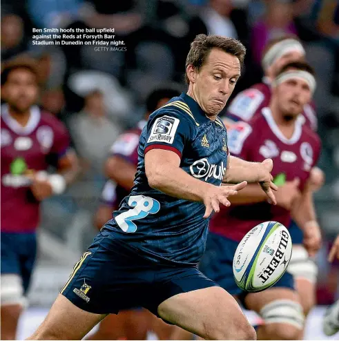 ?? GETTY IMAGES ?? Ben Smith hoofs the ball upfield against the Reds at Forsyth Barr Stadium in Dunedin on Friday night.