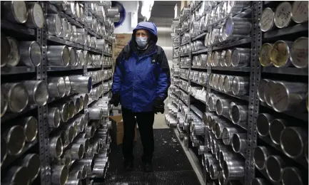  ?? (Megan Jelinger/Reuters) ?? LONNIE THOMPSON, professor and research scientist at The Ohio State University, stands in a negative thirty degree freezer where ice core samples from a glaciers are kept in the Byrd Polar and Climate Research Center in Columbus, Ohio, earlier this year.