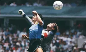  ?? Photograph: El Grafico/Getty Images ?? Diego Maradona uses his hand to score against England at the 1986 World Cup.