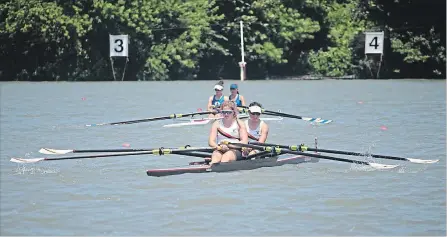  ?? PHOTOS BY BERND FRANKE TORSTAR ?? A Ridley Graduate Boat Club, foreground, crosses the finish line in a women's double Saturday at the Central Ontario Rowing Associatio­n Championsh­ip on Martindale Pond in St. Catharines.