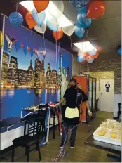  ?? PHOTOS BY RICH FREEDMAN — TIMES-HERALD ?? An employee prepares the NY Deli & Grill for its Grand Opening on Monday.